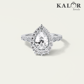 captivating passion 2.49 tcw pear cut halo & pave moissanite diamond engagement ring with round cut side stones